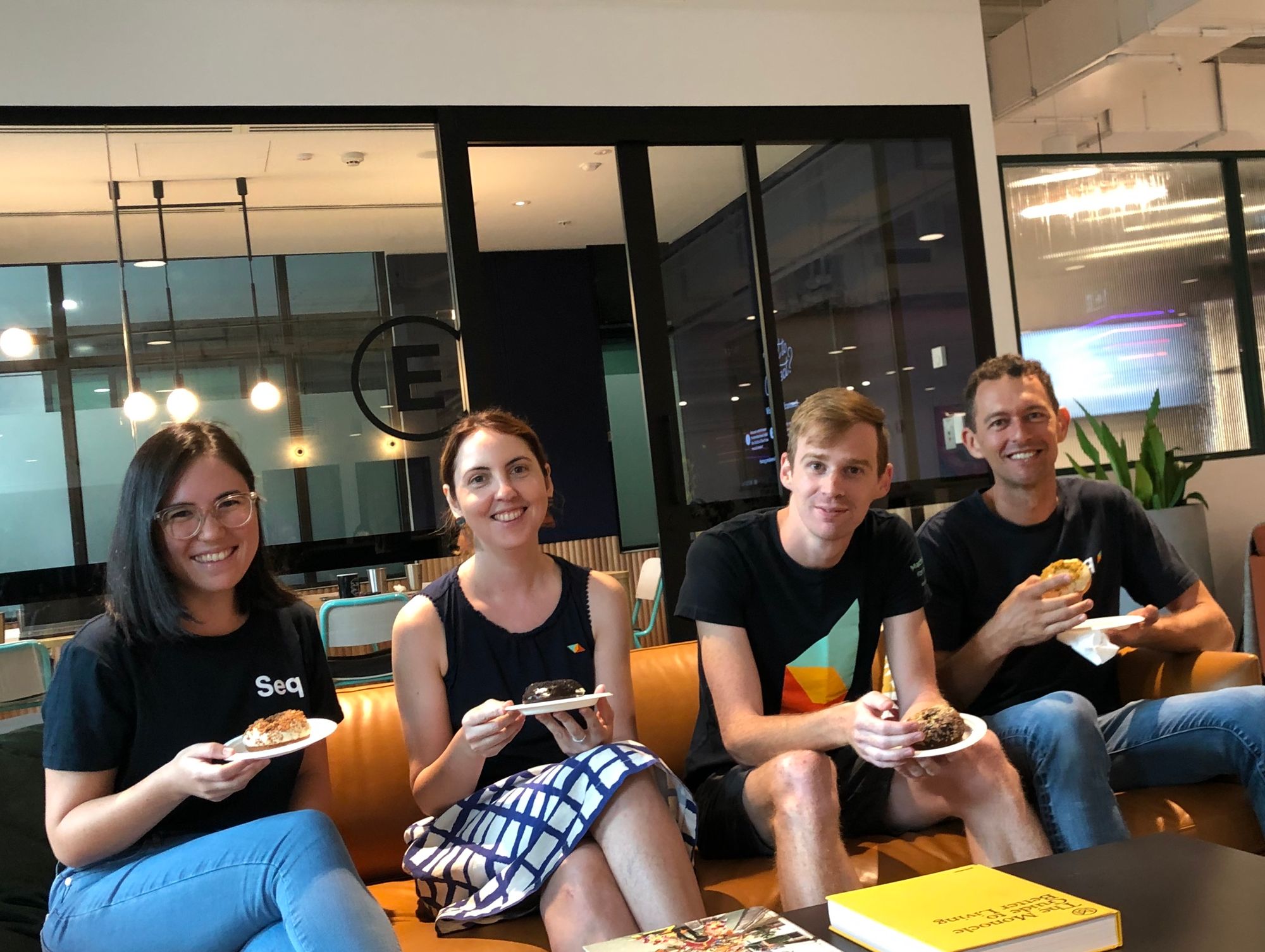 Pictured: The Datalust team – Larene, Susan, Ashley, Nick sitting on a couch eating donuts